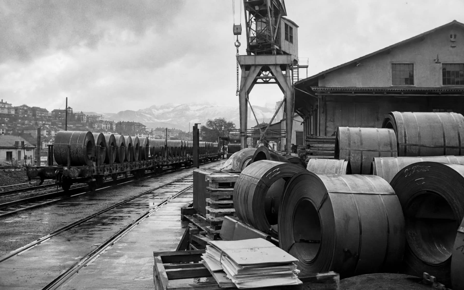 Illustrative archival view of steel coils at a Swiss rail-side trading yard in 1963
